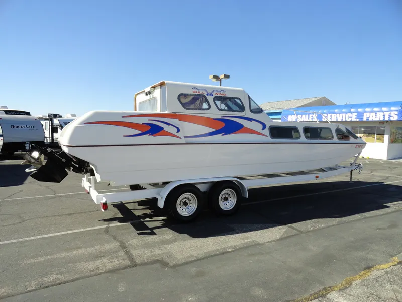Slide: The Image of 1996 Hallett Party Cruiser Gull Wing 300 on trailer, side view. - 5