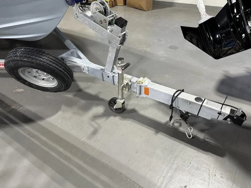 Slide: The Image of Trailer hitch of a 2025 Boston Whaler 190 Montauk boat in a garage setting. - 17