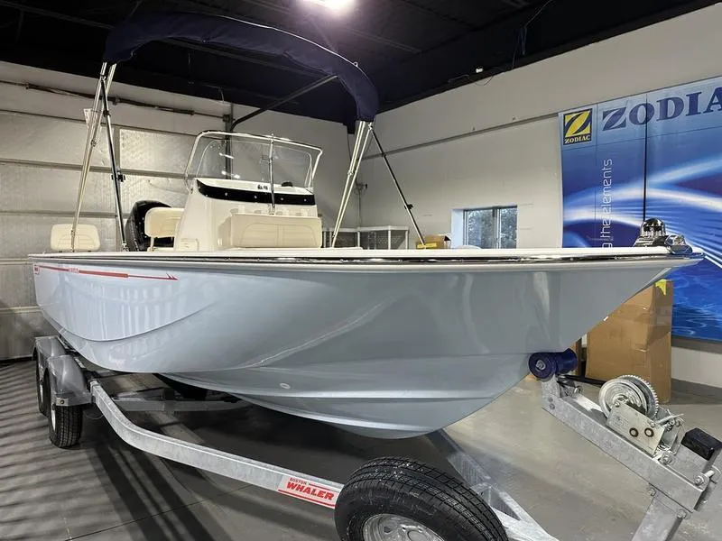 Slide: The Image of 2025 Boston Whaler 190 Montauk boat on trailer in showroom. - 3