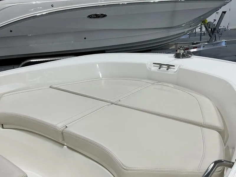 Slide: The Image of 2025 Boston Whaler 170 Montauk boat interior with cushioned seating. - 10