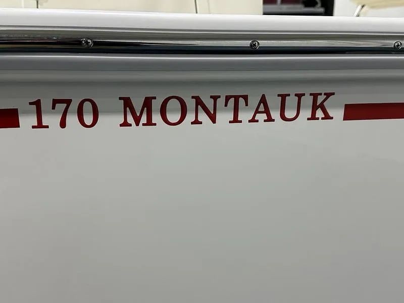 Slide: The Image of 2025 Boston Whaler 170 Montauk boat nameplate in red lettering. - 12