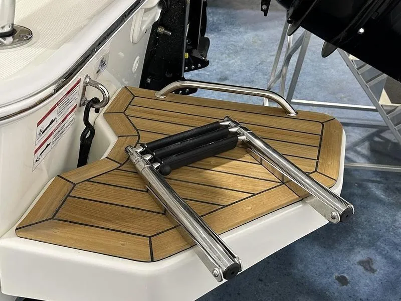 Slide: The Image of 2025 Boston Whaler 170 Montauk swim platform with foldable ladder. - 13