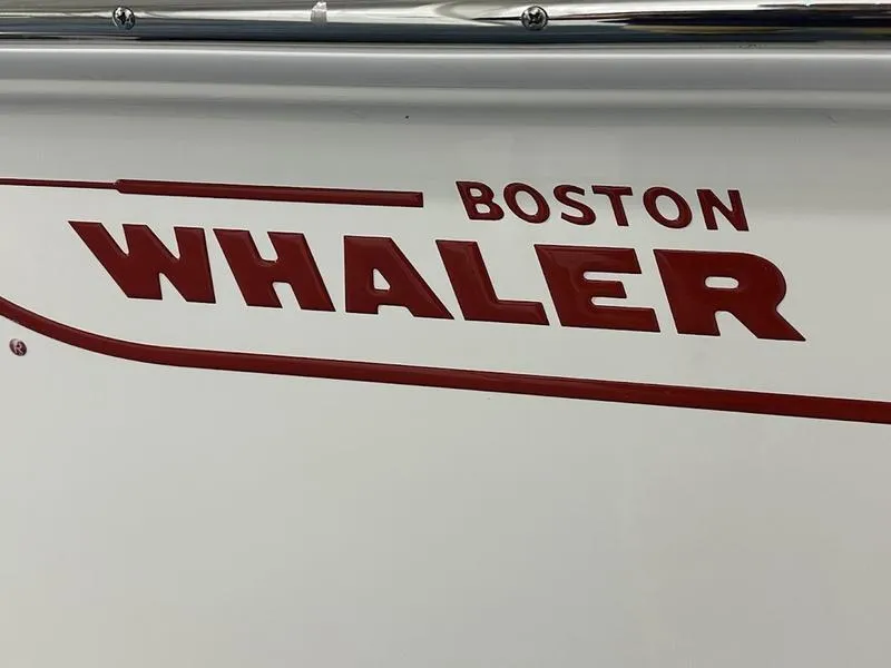 Slide: The Image of Boston Whaler 170 Montauk 2025 logo in bold red lettering on boat exterior. - 14