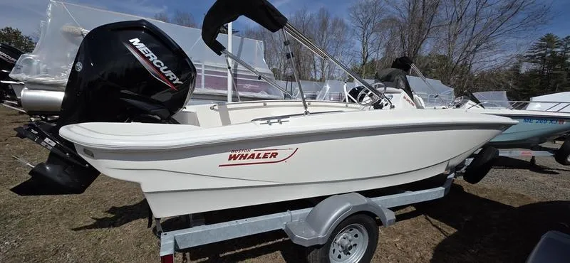 The Image of 2025 Boston Whaler 160 Super Sport boat on trailer, featuring Mercury outboard motor. - 1