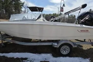 Slide: The Image of 2025 Boston Whaler 160 Super Sport boat on trailer, outdoors in a snowy setting. - 10