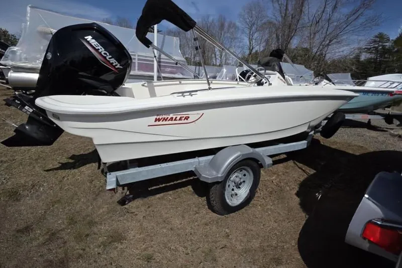 Slide: The Image of 2025 Boston Whaler 160 Super Sport boat on trailer with Mercury engine. - 9