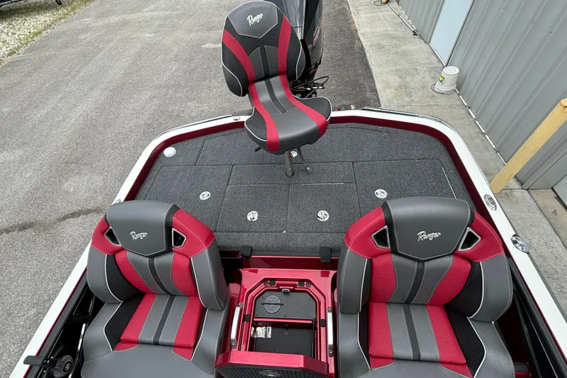 Slide: The Image of 2025 Ranger Z521R boat with red and gray seats, rear deck view. - 10