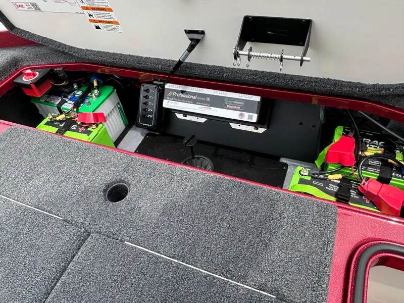 Slide: The Image of 2025 Ranger Z521R boat battery compartment with professional charger and neatly organized wiring. - 14