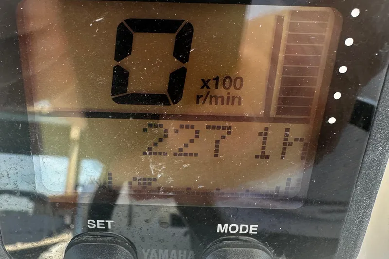 Slide: The Image of Close-up of 2012 Regulator 24 FS boat's digital display showing 227 engine hours. - 4