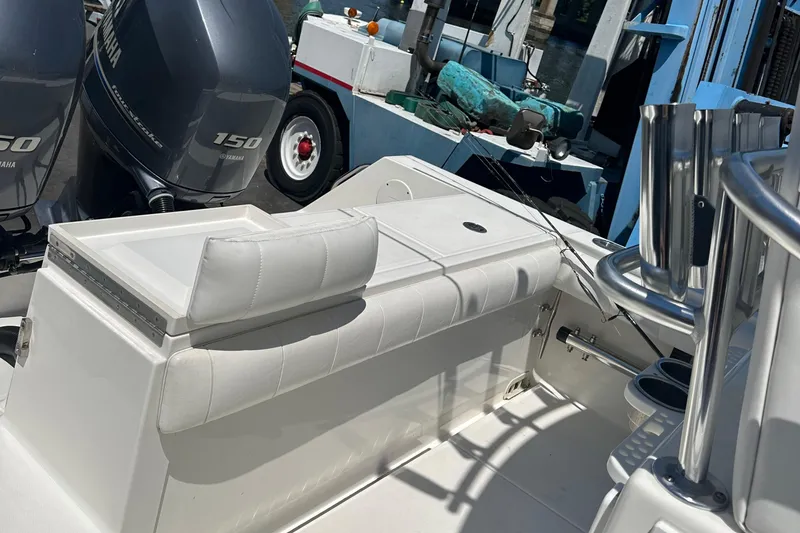 Slide: The Image of 2012 Regulator 24 FS boat with Yamaha 150 engines and white cushioned seating. - 6