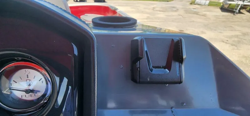 Slide: The Image of 2024 Bennington 20 SVF dashboard with fuel gauge and cup holder. - 21