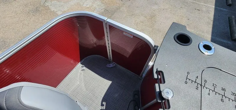 Slide: The Image of 2024 Bennington 20 SVF boat interior with red paneling and gray flooring. - 28