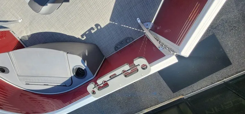 Slide: The Image of 2024 Bennington 20 SVF boat interior with red accents and seating. - 33