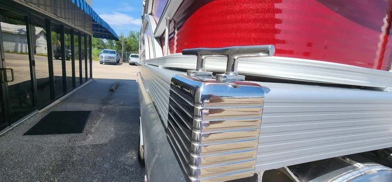 Slide: The Image of 2024 Bennington 20 SVF boat detail with chrome cleat and red accents. - 38