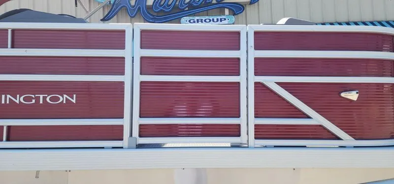 Slide: The Image of 2024 Bennington 20 SVF pontoon boat with red paneling and white trim. - 6