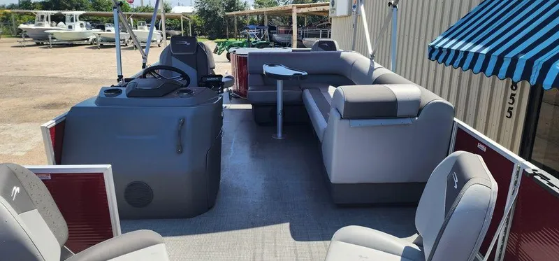 Slide: The Image of 2024 Bennington 20 SVF pontoon boat interior with seating and helm. - 9