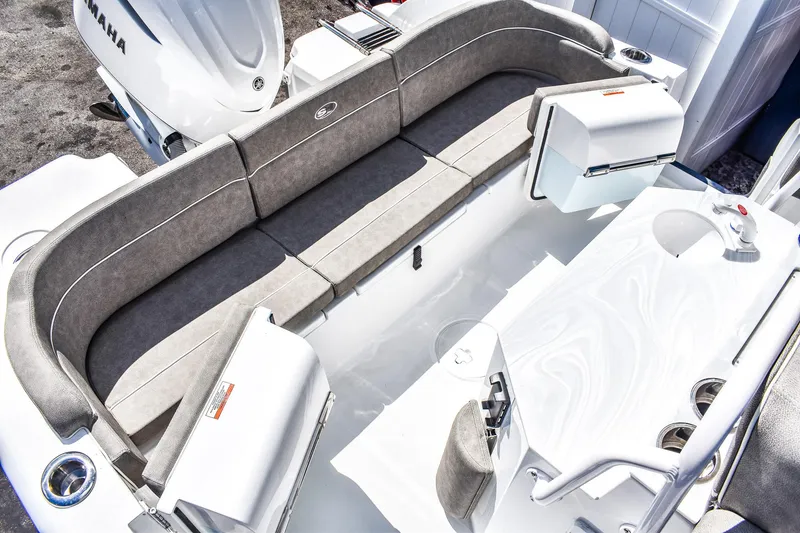 Slide: The Image of 2025 Sea Hunt Escape 25 boat interior with cushioned seating and Yamaha engine. - 3