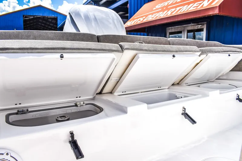Slide: The Image of 2025 Sea Hunt Escape 25 boat storage compartments open, showcasing ample storage space. - 4