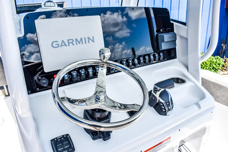 Slide: The Image of 2025 Sea Hunt Escape 25 boat dashboard with Garmin navigation system. - 7