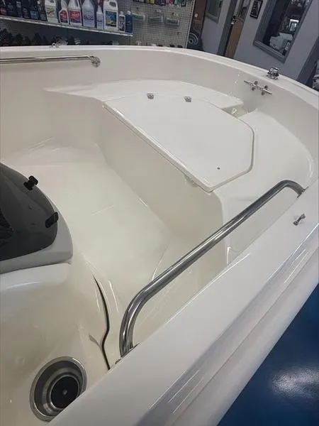 Slide: The Image of 2025 Boston Whaler 130 Super Sport interior, showcasing sleek design and spacious seating. - 5
