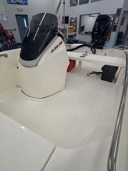 Slide: The Image of 2025 Boston Whaler 130 Super Sport boat interior with sleek design and modern features. - 8