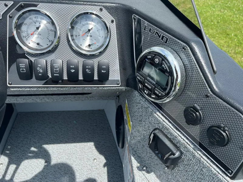 Slide: The Image of Dashboard of 2025 Lund 1775 Adventure SS boat with gauges and controls. - 10
