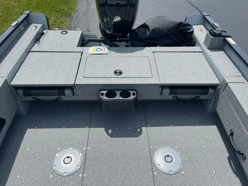 Slide: The Image of 2025 Lund 1775 Adventure SS boat interior with storage compartments and cup holders. - 12