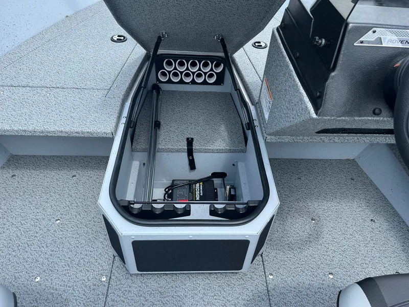 Slide: The Image of 2025 Lund 1775 Adventure SS boat storage compartment with battery and rod holders. - 13