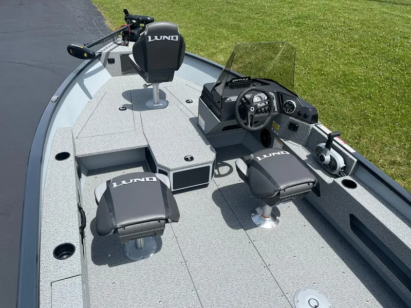 Slide: The Image of 2025 Lund 1775 Adventure SS fishing boat interior with seating and console. - 5