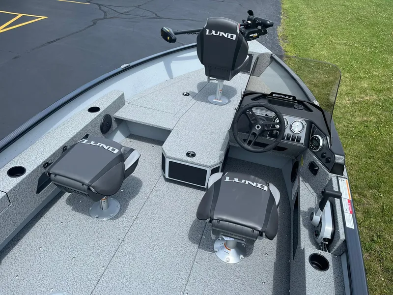 Slide: The Image of 2025 Lund 1775 Adventure SS boat interior with seating and control console. - 6
