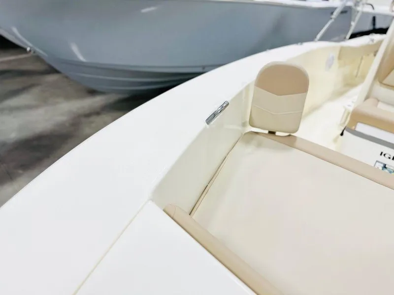 Slide: The Image of 2025 Scout 195 Sportfish boat interior detail with beige seating. - 4