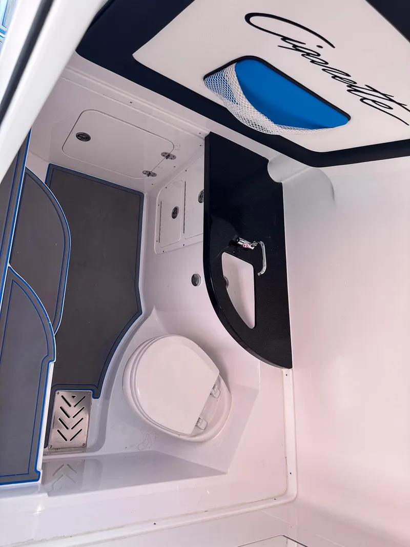 Slide: The Image of 2021 Cigarette 39 GTS boat interior with toilet and sink. - 10