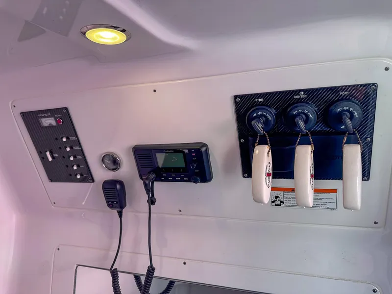 Slide: The Image of Control panel of a 2021 Cigarette 39 GTS boat with communication devices. - 11