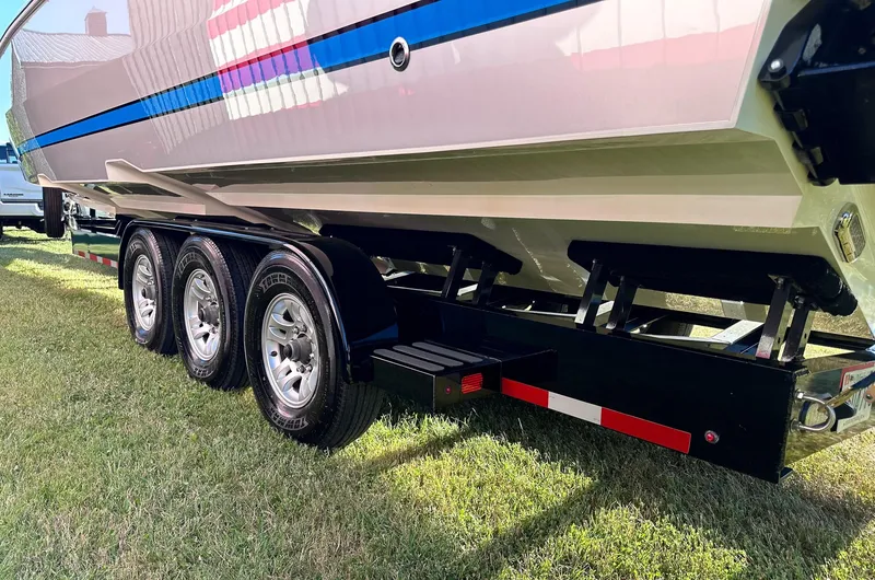 Slide: The Image of 2021 Cigarette 39 GTS boat on a triple-axle trailer, side view. - 14