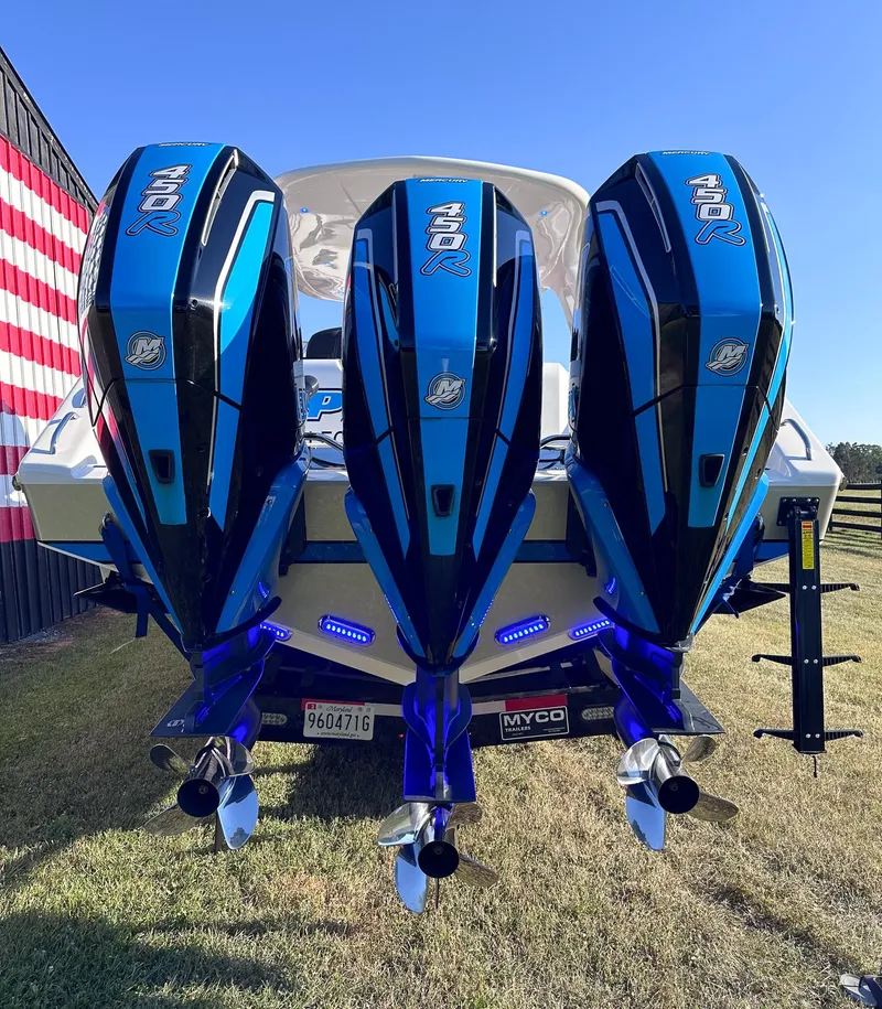 Slide: The Image of 2021 Cigarette 39 GTS boat with triple outboard engines, rear view. - 18