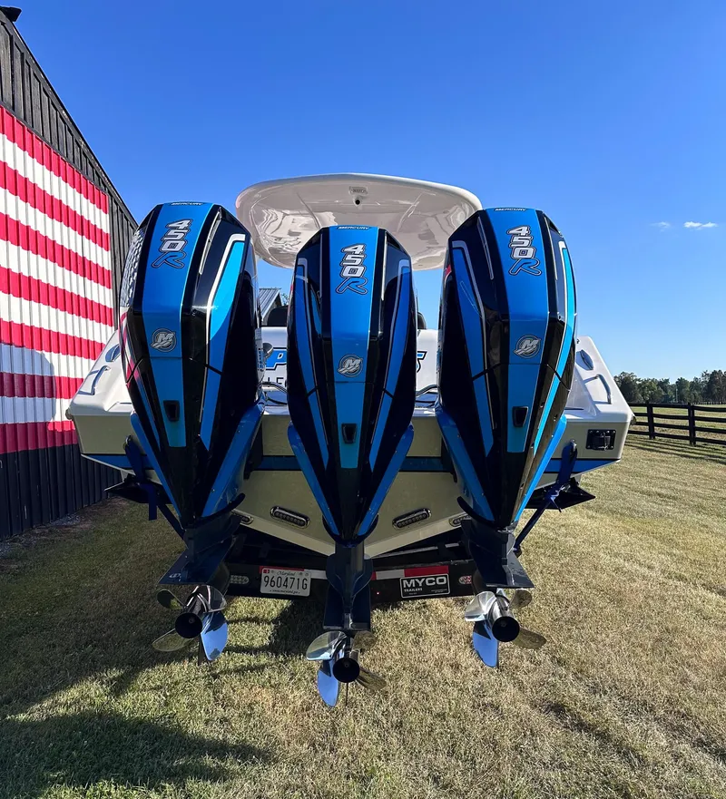 Slide: The Image of 2021 Cigarette 39 GTS boat with triple outboard engines. - 4