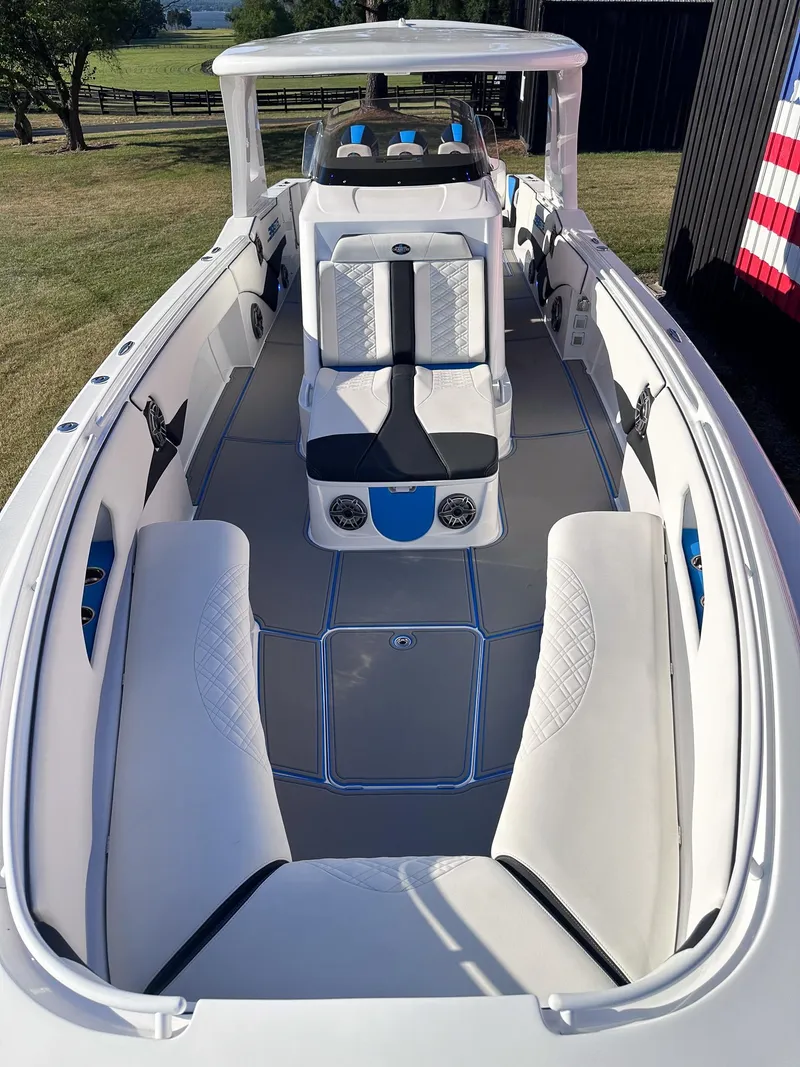 Slide: The Image of 2021 Cigarette 39 GTS boat interior with white and blue seating. - 9