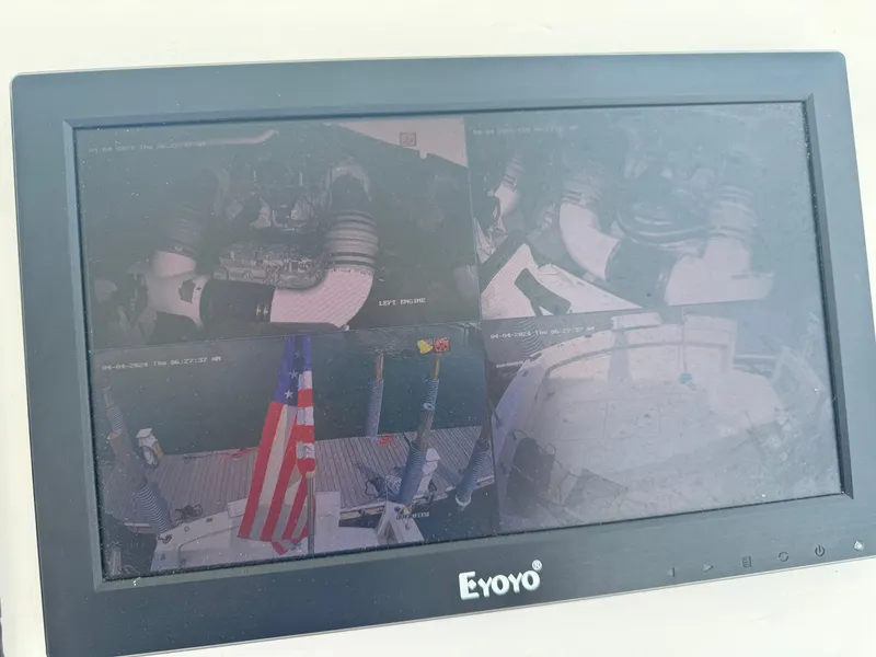 Slide: The Image of Monitor displaying multiple camera views on a 1994 Hatteras 54 Convertible yacht. - 14