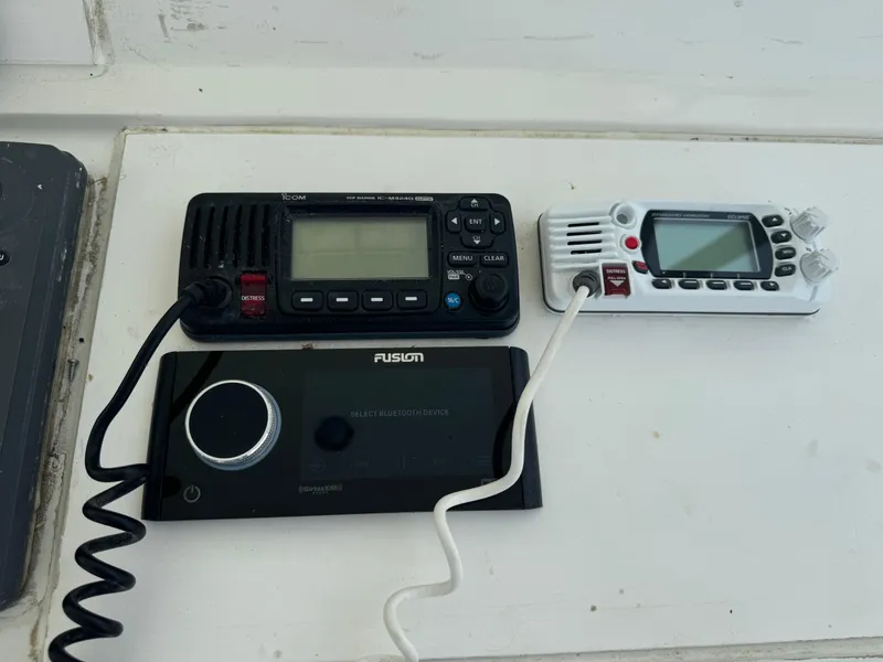 Slide: The Image of Marine radio and audio system on a 1994 Hatteras 54 Convertible yacht dashboard. - 15