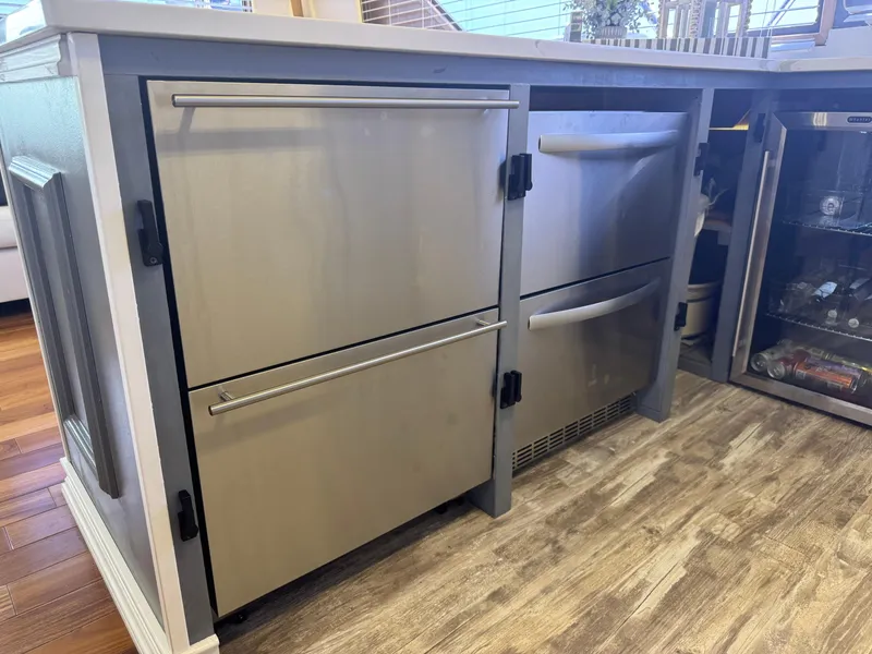 Slide: The Image of Stainless steel kitchen appliances on a 1994 Hatteras 54 Convertible yacht. - 24