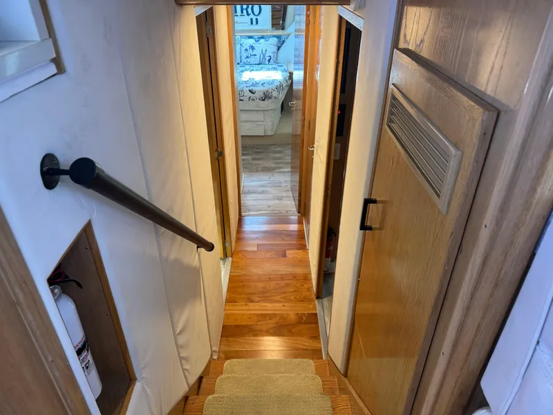 Slide: The Image of Interior hallway of 1994 Hatteras 54 Convertible yacht with wooden flooring. - 30