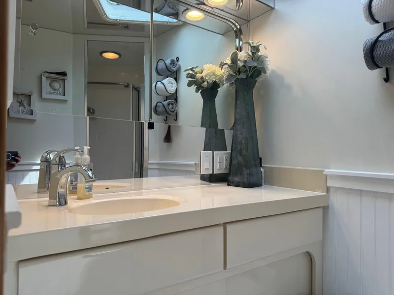 Slide: The Image of Luxurious bathroom interior of 1994 Hatteras 54 Convertible yacht with elegant decor. - 37