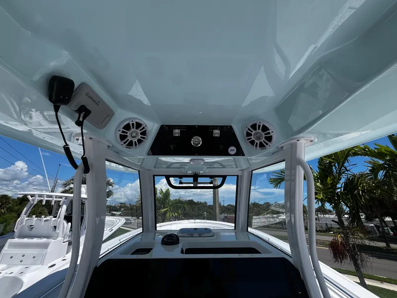 Slide: The Image of 2024 Sportsman 322 OPEN CC boat console with speakers and electronics. - 10