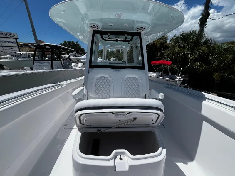 Slide: The Image of 2024 Sportsman 322 OPEN CC center console boat with seating and storage. - 22