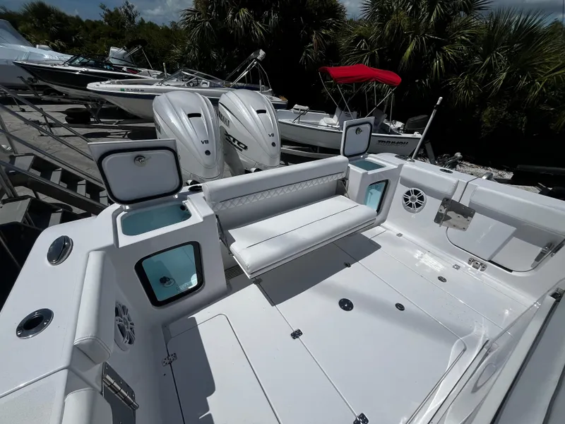 Slide: The Image of 2024 Sportsman 322 OPEN CC boat with dual engines and spacious deck. - 5