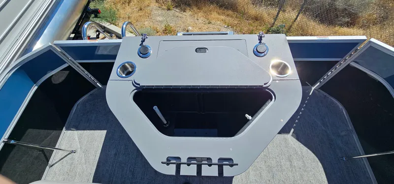 Slide: The Image of 2025 South Bay 224FCRLE boat fishing station with rod holders and cup holders. - 10