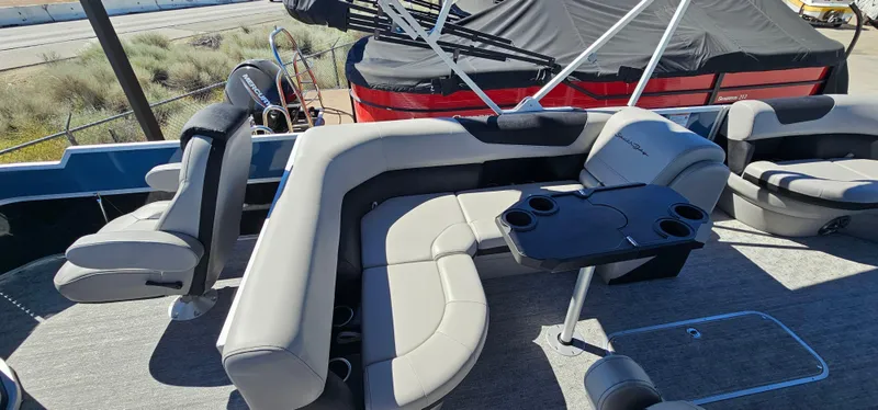 Slide: The Image of 2025 South Bay 224FCRLE pontoon boat with spacious seating and table. - 12