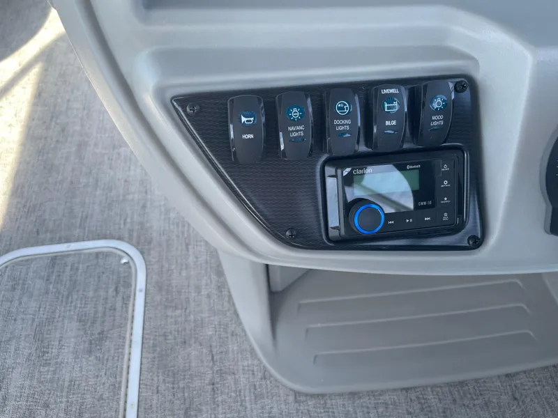 Slide: The Image of Control panel of 2025 South Bay 224FCRLE with switches and Clarion audio system. - 16