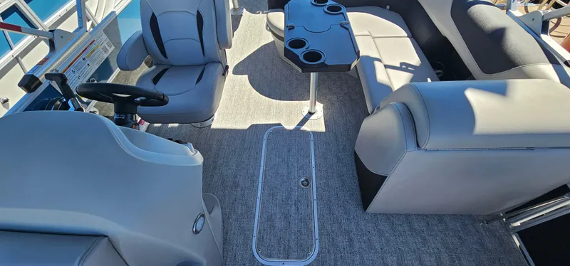 Slide: The Image of 2025 South Bay 224FCRLE boat interior with seating and table. - 18