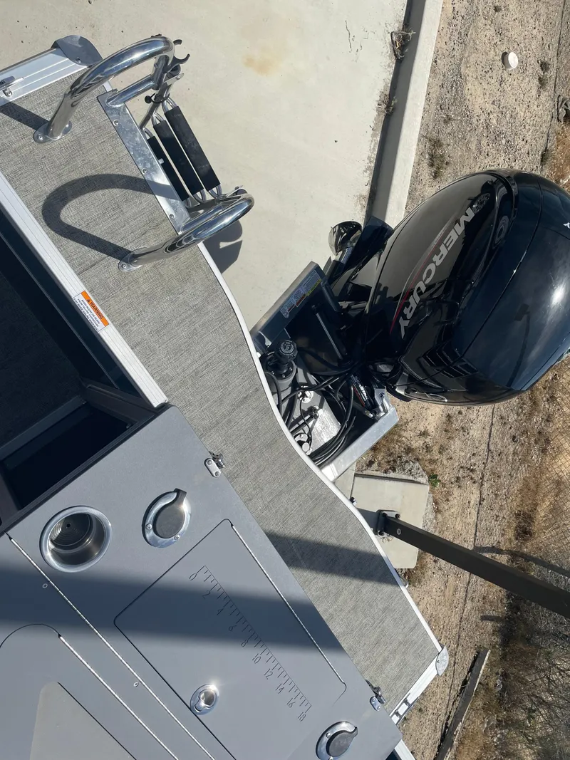 Slide: The Image of 2025 South Bay 224FCRLE boat with Mercury outboard motor, viewed from above. - 19